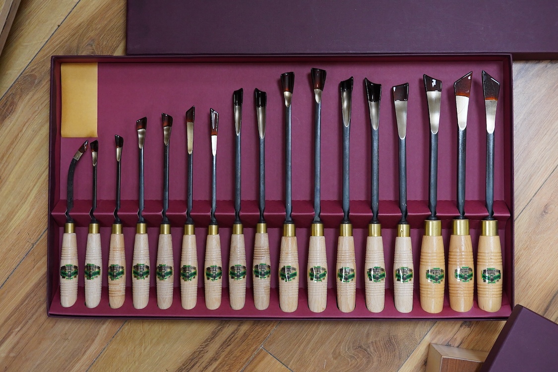 Three sets of Henry Taylor Tools Limited of Sheffield, wood carving chisels, comprising of a 12-carving chisel set contained within a fitted beech case, a set of 17 skew gouges in a fitted card case, and a set of 12 micr